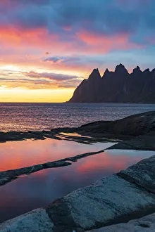 Midnight sun over the mountain peaks Devil's Teeth, Tungeneset, Senja, Troms county Midnight sun over the mountain peaks Devil's Teeth, Tungeneset, Senja, Troms county