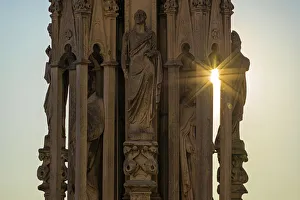 Milan, Lombardy, Italy Detail of a statue on one of the spiers of Milano Cathedral Milan, Lombardy, Italy Detail of a statue on one of the spiers of Milano Cathedral