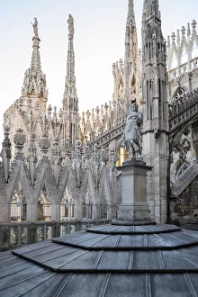 Milan, Lombardy, Italy One of the many statues on the rooftop of Milan Cathedral Milan, Lombardy, Italy One of the many statues on the rooftop of Milan Cathedral