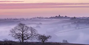 Mist shrouded countryside looking towards the village of Morchard Bishop, Devon, England Mist shrouded countryside looking towards the village of Morchard Bishop, Devon, England