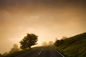 Misty conditions at sunrise on a moorland road, Brecon Beacons National Park, Powys Misty conditions at sunrise on a moorland road, Brecon Beacons National Park, Powys