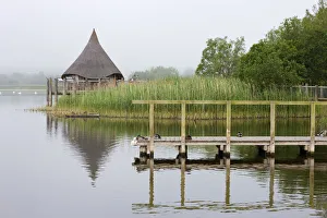 Misty morning beside the jetty and thatched hut on Llangorse Lake, Brecon Beacons Misty morning beside the jetty and thatched hut on Llangorse Lake, Brecon Beacons