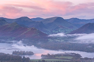 Misty sunrise over Derwent Water and the Newlands Valley, Lake District, Cumbria, England Misty sunrise over Derwent Water and the Newlands Valley, Lake District, Cumbria, England