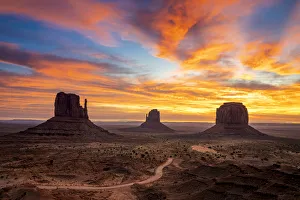 The Mittens against colourful cloudy sky at sunrise, Monument Valley, Arizona, USA The Mittens against colourful cloudy sky at sunrise, Monument Valley, Arizona, USA
