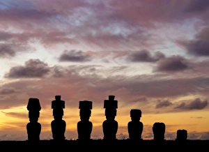 Moais in Ahu Nau Nau by the Anakena Beach at sunset, Rapa Nui National Park, Easter Island Moais in Ahu Nau Nau by the Anakena Beach at sunset, Rapa Nui National Park, Easter Island