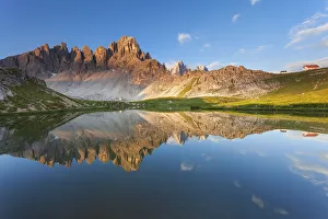 Monte Paterno, Dolomites, Italy. An alpine lake its reflecting the first lights Monte Paterno, Dolomites, Italy. An alpine lake its reflecting the first lights