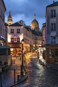 Montmartre at night with illuminated Sacre Coeur Basilica in the background, Paris Montmartre at night with illuminated Sacre Coeur Basilica in the background, Paris
