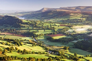 Morning sunshines illuminates the patchwork fields in the Usk Valley, looking towards Morning sunshines illuminates the patchwork fields in the Usk Valley, looking towards