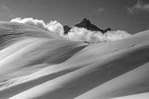 Mount Civetta emerges from the clouds over the slopes of Col Nudo after a heavy snowfall Mount Civetta emerges from the clouds over the slopes of Col Nudo after a heavy snowfall
