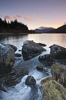 Mount Snowdon at dusk viewed from the rocky shores of Llynnau Mymbyr, Snowdonia National Mount Snowdon at dusk viewed from the rocky shores of Llynnau Mymbyr, Snowdonia National