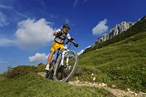 Mountain biker on the Kampenwand, Chiemgau, Upper Bavaria, Bavaria, Germany, MR Mountain biker on the Kampenwand, Chiemgau, Upper Bavaria, Bavaria, Germany, MR