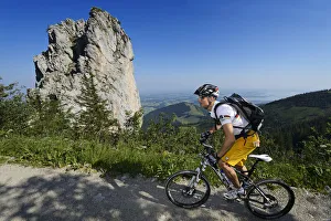 Mountain bikers before Staffelstein, Kampenwand, Chiemgau, Upper Bavaria, Bavaria Mountain bikers before Staffelstein, Kampenwand, Chiemgau, Upper Bavaria, Bavaria