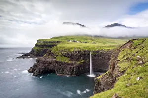 Mulafossur waterfall and the little village of Gasadalur, Vagar island, Faroe Islands Mulafossur waterfall and the little village of Gasadalur, Vagar island, Faroe Islands