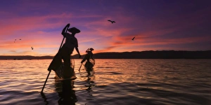 Myanmar (Burma), Shan State, Inle Lake, local fishermen at sunset Myanmar (Burma), Shan State, Inle Lake, local fishermen at sunset
