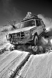 Prints of Namibia, Damaraland. The desert environment and lack of paved roads in many the interior region means that the most travel is by four wheel drive vechicles Related Prints: Namibia, Damaraland Print: A Four-Wheel Drive Landscape
