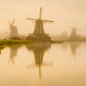 Netherlands, North Holland, Zaandam, Zaanse Schans, left to right The Seeker (De Zoeker) Oilmill Netherlands, North Holland, Zaandam, Zaanse Schans, left to right The Seeker (De Zoeker) Oilmill