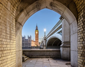 Night view of Big Ben and Westminster Palace from an old alley on the river bank Night view of Big Ben and Westminster Palace from an old alley on the river bank