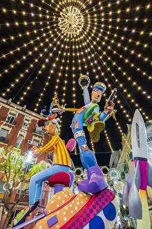 Night view of giant sculptures in Ruzafa or Russafa ward during the Annual Fallas Festival, Valencia, Spain Night view of giant sculptures in Ruzafa or Russafa ward during the Annual Fallas Festival, Valencia, Spain