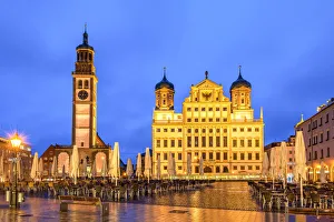 Night view of Rathausplatz with Perlachturm tower on the left side and the city hall Night view of Rathausplatz with Perlachturm tower on the left side and the city hall