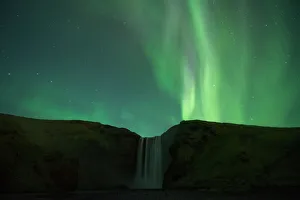 Northern lights over Skogafoss waterfall, Southern Iceland, Iceland Northern lights over Skogafoss waterfall, Southern Iceland, Iceland
