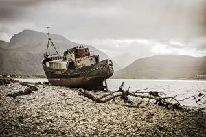 The Old Boat of Corpach with Ben Nevis in the background, Fort William, Scotland, UK The Old Boat of Corpach with Ben Nevis in the background, Fort William, Scotland, UK