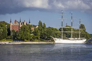Old tall ship Af Chapman in front of Skeppsholmen island with Admiralitetshuset Old tall ship Af Chapman in front of Skeppsholmen island with Admiralitetshuset