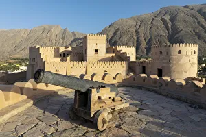 Oman, Al-Batinah Region, Nakhal, Nakhal Fort and cannon located at the foot of Jebel Oman, Al-Batinah Region, Nakhal, Nakhal Fort and cannon located at the foot of Jebel