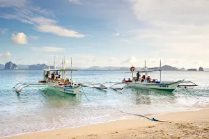Outrigger boats anchored at Dilumacad Island (Helicopter Island), El Nido, Palawan Outrigger boats anchored at Dilumacad Island (Helicopter Island), El Nido, Palawan
