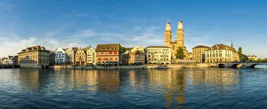 Panoramic of Limmatquai and Grossmunster Cathedral along Limmat River at sunset, Zurich Panoramic of Limmatquai and Grossmunster Cathedral along Limmat River at sunset, Zurich