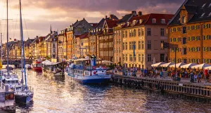 Panoramic view of Nyhavn water canal at sunset in Copenhagen, Denmark Panoramic view of Nyhavn water canal at sunset in Copenhagen, Denmark