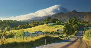 Panoramic view of the road loeading to Taranaki volcano in New Zealand northern island Panoramic view of the road loeading to Taranaki volcano in New Zealand northern island