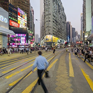 Pedestrians and traffic at a busy road crossing in Causeway Bay, Hong Kong Island Pedestrians and traffic at a busy road crossing in Causeway Bay, Hong Kong Island