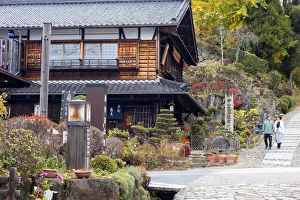 People walking along Nakasendo Way passing through Magome, Gifu Prefecture, Japan People walking along Nakasendo Way passing through Magome, Gifu Prefecture, Japan