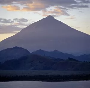 Related Images Collection: Photographed from Lake Mutanda at sunrise, Mount Muhavura looms like a huge pyramid