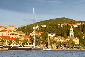 The picturesque harbor town of Cavtat illuminated at sunset, Cavtat, Dalmatia, Croatia The picturesque harbor town of Cavtat illuminated at sunset, Cavtat, Dalmatia, Croatia
