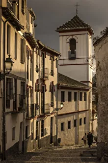 Picturesque sunset view of a street in the Albayzin district, Granada, Andalusia, Spain Picturesque sunset view of a street in the Albayzin district, Granada, Andalusia, Spain