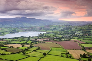 Pink sunset above the Brecon Beacons mountain range and rural countryside near Llangorse Pink sunset above the Brecon Beacons mountain range and rural countryside near Llangorse