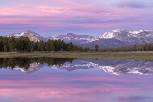 Pink sunset sky above Tuolumne Meadows, Yosemite National Park, California, USA. Spring Pink sunset sky above Tuolumne Meadows, Yosemite National Park, California, USA. Spring