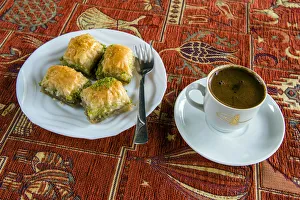 Plate with traditional baklava Turkish sweet and cup of Turkish coffee Plate with traditional baklava Turkish sweet and cup of Turkish coffee