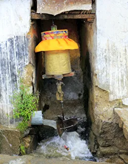 Prayer wheel moved by water, Drepung monastery, Mount Gephel, Lhasa Prefecture, Tibet Prayer wheel moved by water, Drepung monastery, Mount Gephel, Lhasa Prefecture, Tibet