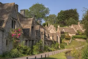 Prints of Pretty cottages at Arlington Row in the Cotswolds village of Bibury, Gloucestershire, England. Summer (July) Gloucestershire Prints: Print of Arlington Row Cottages, Bibury
