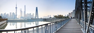 Pudong skyline across the Suzhou Creek and Waibaidu bridge, Shanghai, China Pudong skyline across the Suzhou Creek and Waibaidu bridge, Shanghai, China