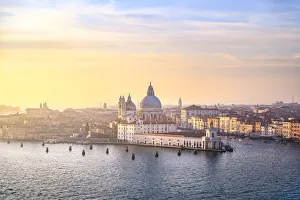 Punta della Dogana during sunset as seen from St George island. Venice, Veneto, Italy Punta della Dogana during sunset as seen from St George island. Venice, Veneto, Italy