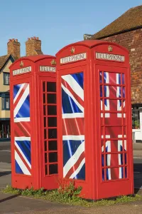 Prints of England, Kent, Canterbury, Traditional Red Telephone Boxes with Union Jack Flagred Canterbury Prints: England Print: Traditional Red Telephone Boxes with Union Jack Flag