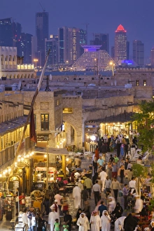 Qatar, Doha, Souq Waqif, redeveloped bazaar area, elevated view with West Bay skyscrapers Qatar, Doha, Souq Waqif, redeveloped bazaar area, elevated view with West Bay skyscrapers