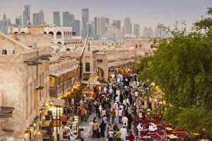 Qatar, Doha, Souq Waqif, redeveloped bazaar area, elevated view with West Bay skyscrapers Qatar, Doha, Souq Waqif, redeveloped bazaar area, elevated view with West Bay skyscrapers