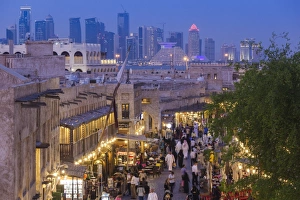 Qatar, Doha, Souq Waqif, redeveloped bazaar area, elevated view with West Bay skyscrapers Qatar, Doha, Souq Waqif, redeveloped bazaar area, elevated view with West Bay skyscrapers