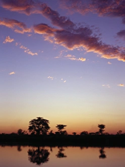 African Sunset Images Prints: The last rays of the setting sun over the Okavango River at Rundu