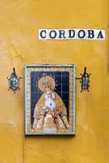 Religious icon tile work of the Virgin Mary or Madonna in a street of Seville, Andalusia Religious icon tile work of the Virgin Mary or Madonna in a street of Seville, Andalusia