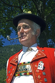 Prints of A Swiss man smoking a pipe in traditional alpine costume at the Unspunnen Bicentenary Festival, Interlaken, Jungfrau Region, Switzerland Images Dated 2006 September: Swiss Man in Alpine Costume Smoking a Pipe Print
